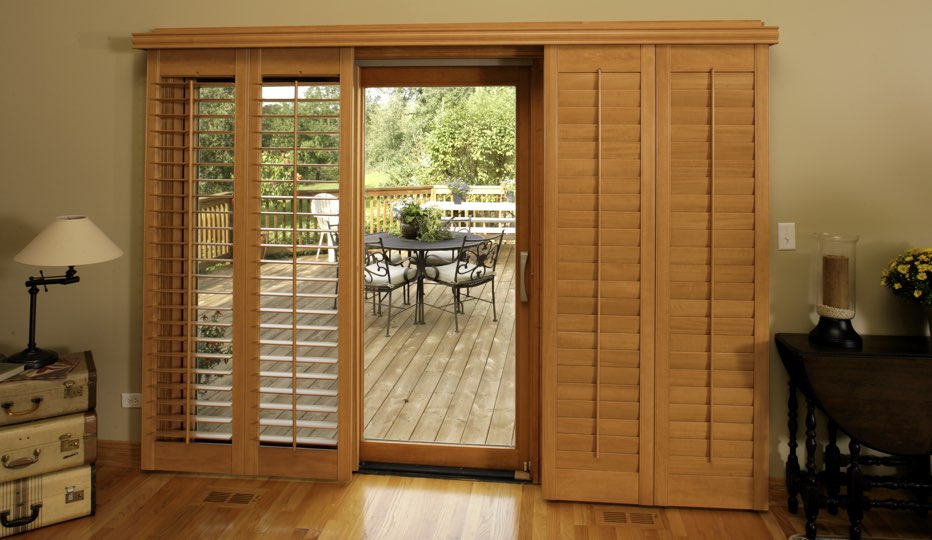 2 Styles Of Patio Door Shutters For Fort Myers Bypass Wood Patio Door Shutters In A Fort Myers Living Room