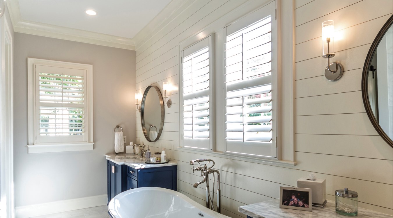 Fort Myers bathroom with white plantation shutters.