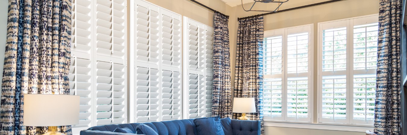 Interior shutters in Cypress Lake living room