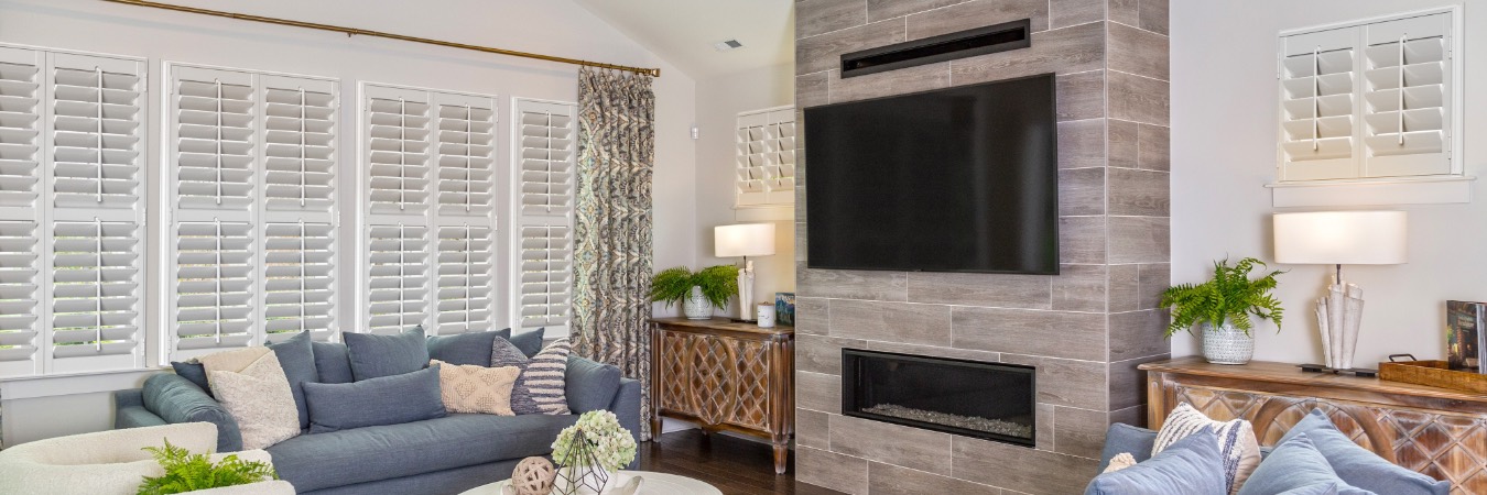 Interior shutters in Lehigh Acres living room with fireplace