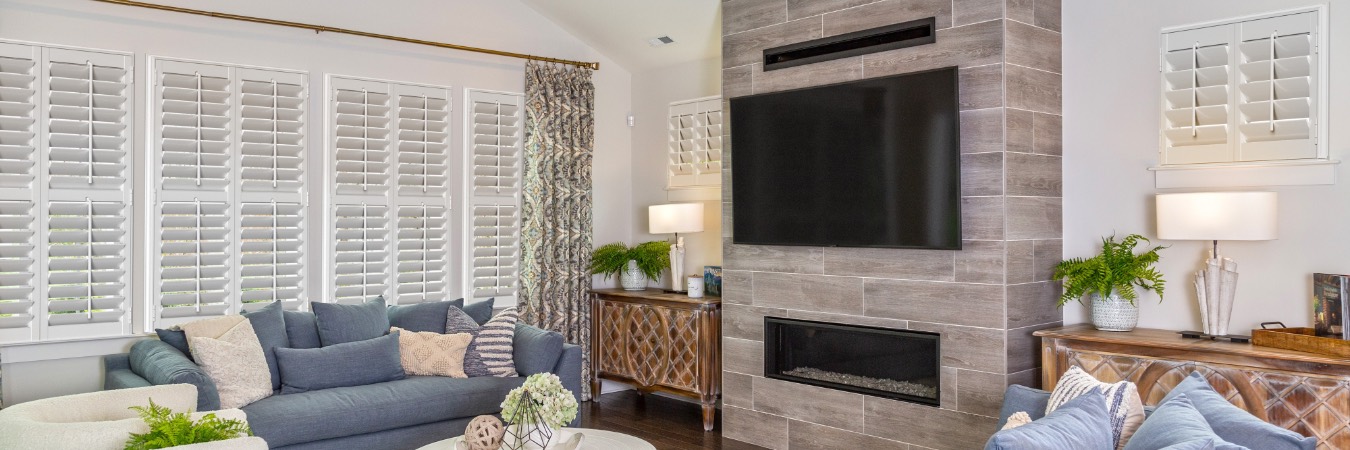 Interior shutters in Burnt Store Marina living room with fireplace