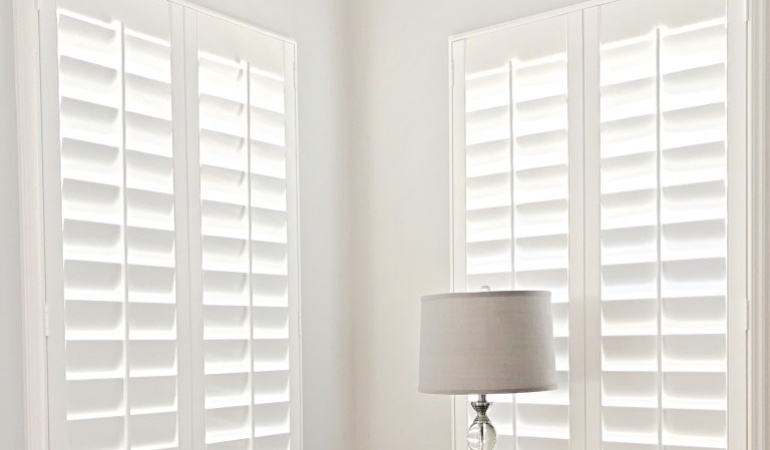 Plantation shutters in a corner window.