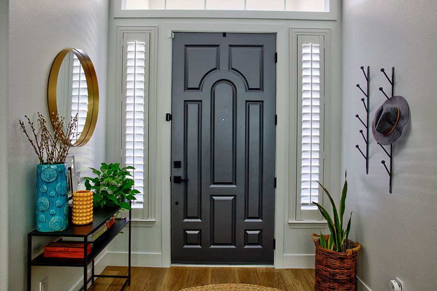 Polywood shutters on skinny sidelight windows by a front door