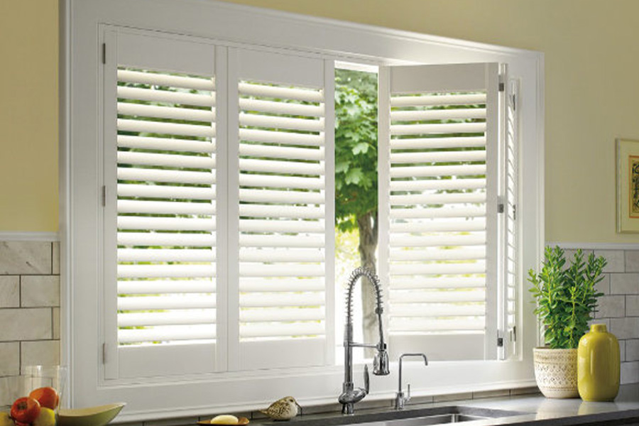 Polywood shutters are built to withstand the test of time in Fort Myers. White Polywood shutters above a kitchen sink.
