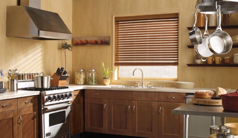 Faux wood blinds look stunning in Fort Myers kitchens. Fort Myers kitchen faux wood blinds.