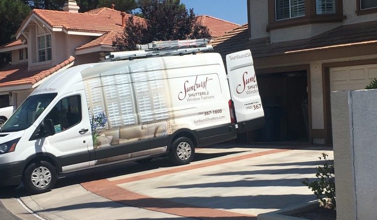 At an in-home consultation, we take the showroom to your room. Alt text: Sunburst Shutters van at customer's home.