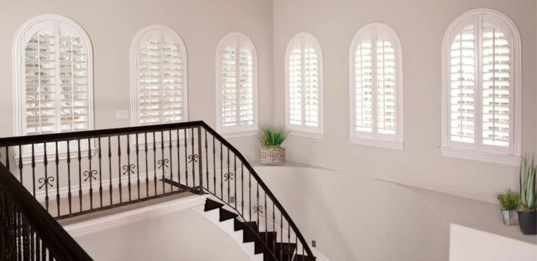 Custom coverings completely cover your window and hang perfectly. Arched Plantation Shutters