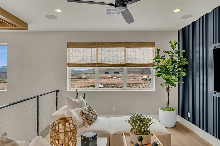 Fort Myers homeowners who want eco-friendly home fixtures should consider natural woven shades. Natural brown woven shades on a window in a stylish sitting area