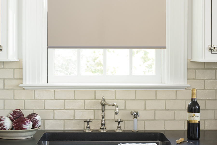 Roller shades opens up a lot of color and style options for your gourmet kitchen at Fort Myers. Roller shade above a kitchen sink.