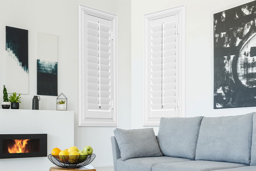 White Polywood shutters add character and class in Fort Myers. White polywood shutters in a corner of a modern living room.